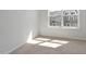 Sunlit bedroom featuring neutral carpet and a window with a view at 284 Chesapeake Commons St # 150, Garner, NC 27529