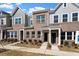 Well-maintained townhomes boasting brick and siding exteriors and tidy landscaping at 284 Chesapeake Commons St # 150, Garner, NC 27529
