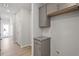 Hallway with gray cabinets and wood-look floors at 284 Chesapeake Commons St # 150, Garner, NC 27529