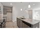 This kitchen features stainless appliances, granite countertops and a large island at 284 Chesapeake Commons St # 150, Garner, NC 27529