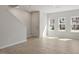 Bright living room featuring wood-look floors, fresh paint, and natural light at 284 Chesapeake Commons St # 150, Garner, NC 27529
