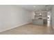 The open-concept space showcases a kitchen with a large island and stainless appliances at 284 Chesapeake Commons St # 150, Garner, NC 27529