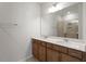 Bathroom featuring a double vanity, granite countertops, and large mirror at 288 Chesapeake Commons St # 149, Garner, NC 27529