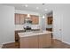 Modern kitchen with an island, stainless steel appliances, and plentiful cabinet space at 288 Chesapeake Commons St # 149, Garner, NC 27529