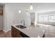 Modern kitchen with an island, stainless steel sink, and sleek countertops in an open layout at 288 Chesapeake Commons St # 149, Garner, NC 27529