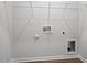 Functional laundry room with shelving and hookups at 288 Chesapeake Commons St # 149, Garner, NC 27529