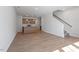 Spacious open-concept living room with hardwood floors that transitions to the kitchen and staircase at 288 Chesapeake Commons St # 149, Garner, NC 27529