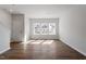 Bright living room with hardwood floors, large windows, and neutral paint, creating a welcoming atmosphere at 288 Chesapeake Commons St # 149, Garner, NC 27529
