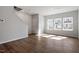 Bright living room with hardwood floors, large windows, and neutral paint, creating a welcoming atmosphere at 288 Chesapeake Commons St # 149, Garner, NC 27529