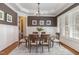 Formal dining room with wainscoting, chandelier, and hardwood floors at 305 Melvin Jackson Dr, Cary, NC 27519