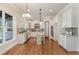 Modern kitchen with white cabinets, granite countertops, and stainless steel appliances at 305 Melvin Jackson Dr, Cary, NC 27519