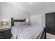 Bedroom with double doors and neutral color scheme at 317 S Kramer Path, Clayton, NC 27527