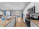 Modern kitchen with granite countertops and stainless steel appliances at 317 S Kramer Path, Clayton, NC 27527