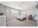 Bright bedroom with a bed, desk, and carpeted floor at 3534 Cashew Dr, Raleigh, NC 27616