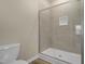 New bathroom featuring a glass enclosed shower with a built-in niche and a toilet at 512-A E Graham St, Mebane, NC 27302