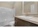 Bathroom features a vanity with a sleek countertop, a large mirror, and a convenient shower-tub combo at 512-A E Graham St, Mebane, NC 27302