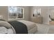 Bedroom with plush carpet, a large window view, and a dresser at 512-A E Graham St, Mebane, NC 27302