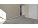 Bright bedroom features plush carpet, neutral walls, and a doorway view to the hallway at 512-A E Graham St, Mebane, NC 27302