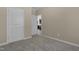 Neutral bedroom with two white doors and soft carpet, providing a simple and clean aesthetic at 512-A E Graham St, Mebane, NC 27302