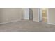 Neutral carpeted bedroom features doorways to closet and shower at 512-A E Graham St, Mebane, NC 27302