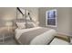 Cozy bedroom features a large window view and neutral color palette at 512-A E Graham St, Mebane, NC 27302