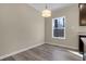 Bright dining area with large window and hardwood floors at 512-A E Graham St, Mebane, NC 27302