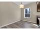 Empty Dining Room offers wood-look floors and a large bright window at 512-A E Graham St, Mebane, NC 27302