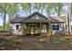 Charming one-story home with a cozy front porch nestled in a wooded lot at 512-A E Graham St, Mebane, NC 27302
