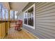 Charming front porch with rocking chair and wooden railings at 512-A E Graham St, Mebane, NC 27302