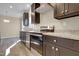 Well-equipped kitchen with stainless steel appliances, granite countertops, and ample cabinet space at 512-A E Graham St, Mebane, NC 27302
