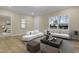 Bright living room features modern furnishings and an abundance of natural light from the large window at 512-A E Graham St, Mebane, NC 27302