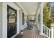 Inviting front porch with rocking chairs and white columns at 5736 Manor Plantation Dr, Raleigh, NC 27603