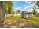 Spacious backyard with shed and fire pit at 619 Barbour St, Clayton, NC 27520