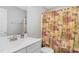 Bathroom with single vanity and nature-themed shower curtain at 619 Barbour St, Clayton, NC 27520