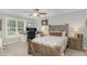 Spacious bedroom with wood bed frame and built-in desk at 619 Barbour St, Clayton, NC 27520