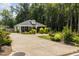 Charming one-story house with a gray exterior, landscaped yard, and a spacious driveway at 619 Barbour St, Clayton, NC 27520