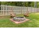 Relaxing fire pit area with two wooden chairs at 619 Barbour St, Clayton, NC 27520