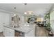 Island kitchen with granite countertops and open concept to living room at 619 Barbour St, Clayton, NC 27520