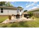 Cozy patio with seating area, grill, and lush landscaping at 619 Barbour St, Clayton, NC 27520