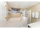 Clean bathroom with a bathtub and shower at 6329 Dry Fork Ln, Raleigh, NC 27617