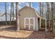 Tan storage shed in backyard at 6329 Dry Fork Ln, Raleigh, NC 27617