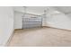 Spacious two car garage with a concrete floor and an insulated garage door at 66 Tennyson Dr, Garner, NC 27529