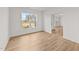 Clean, bright living room with hardwood floors, white walls, and large window providing natural light at 66 Tennyson Dr, Garner, NC 27529