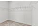 Walk-in closet with built-in wire shelving for optimal organization and storage solutions at 66 Tennyson Dr, Garner, NC 27529