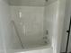 Bright bathroom with a shower-tub combo and grab bar at 69 N Movado Trl, Kenly, NC 27542