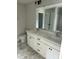 Bathroom featuring a double vanity, modern fixtures, and tiled floors at 69 N Movado Trl, Kenly, NC 27542