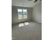 Cozy bedroom with neutral carpet, ample sunlight, and closet at 69 N Movado Trl, Kenly, NC 27542