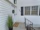 Updated front entry with new door and welcome mat at 707 Wade Ave, Raleigh, NC 27605