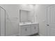 Double vanity bathroom with a large mirror and white cabinets at 7565 Michelle Rd, Rocky Mount, NC 27803