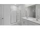 Bathroom with double vanity, a large mirror, and a shower at 7565 Michelle Rd, Rocky Mount, NC 27803